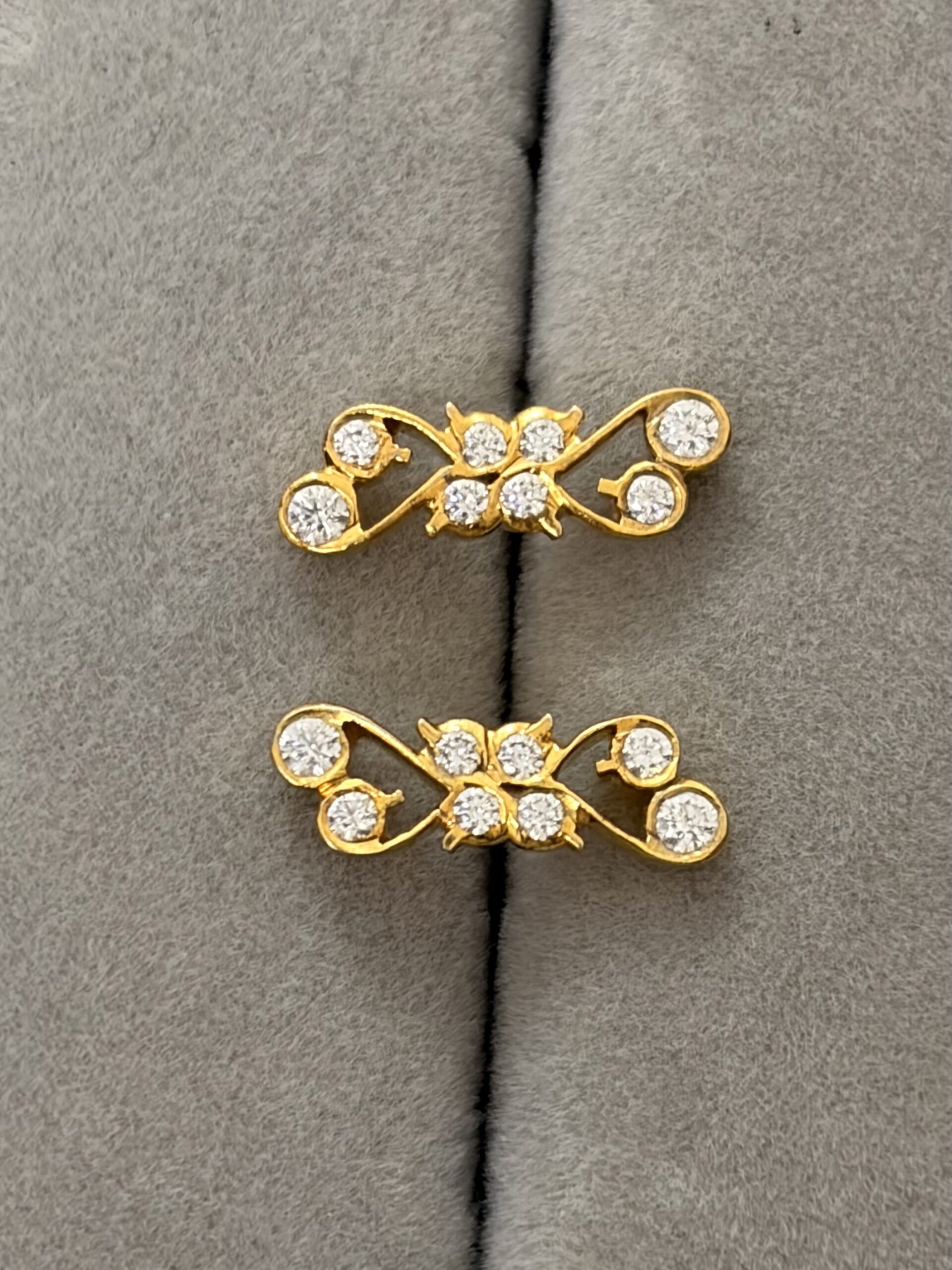 Graceful Infinity Vine Gold Stud Earrings with Sparkling Stones