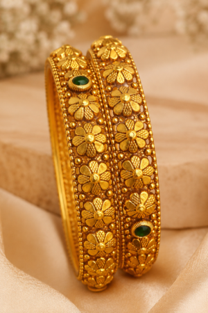 Regal Floral Nakshi Bangles with Emerald Accents